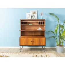 Due to its multifunctional construction, it can be used either in a vintage approach to an antique, unfinished secretary desk with a sizable hutch on top, all made out of exquisite mango wood. Vintage Secretary Desk 1960s Design Market
