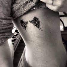 Angel Wings Tattoo On Her Ribs Ink Girly Tattoos Youqueen Rib Tattoos For Women Wings Tattoo Angel Wings Tattoo
