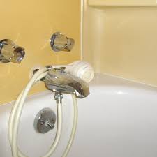 A handheld showerhead is attached to a flexible hose. How To Switch Out Wall Mount And Handheld Showerheads Dengarden