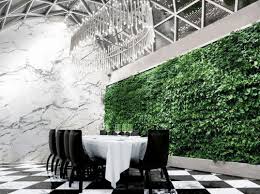 This New Times Square Restaurant Hides A Giant Living Wall Times Square Restaurants Living Wall Vertical Garden