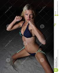 Blond Woman In A Defensive Pose Stock Image - Image Of Bikini, Fighting:  6955235