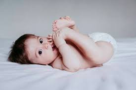Vector child 0000029 background blue boy. Smiling Cute Baby Boy Playing With Duck Toy While Lying Down On Bed At Home Stockphoto