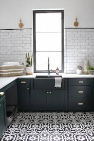 Black And White Tile Flooring Bathroom The Laundry Dog Room Dark Green Cabinets Layered On Classic Black White Design The House Of Silver Lining Green Cabinets White Kitchen Floor White Laundry Rooms