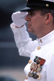 MASTER CHIEF Personnelman (PNCM) Johnnie H. Bristow renders a salute during  the recommissioning ceremony for the battleship USS IOWA (BB 61)