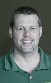 Muskegon Catholic Central coach Mick Homan heads All-Area girls' swimming  team