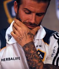 She has five stars printed across her lower back, a hebrew piece running down the back of her neck, and various other pieces on her arms and hands. David Beckham Full Tattoo