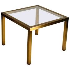Delightfully tapered legs and a bold floral design make this. Minimal Square Brass Coffee Table With Clear Glass Top