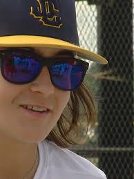 Boy surprised with color blind glasses sees red and more at the Reds game