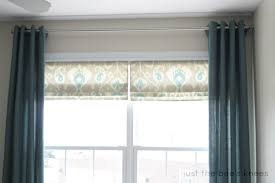 A great way to display beautiful craftsman molding around a window without covering it. Remodelaholic How To Create A Faux Roman Shade