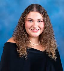 Eva Grace Herring Carnes, daughter of Dr. Heather and Mr. Roy Carnes,  attends Winona High School where she is an officer in the National Honor  Society and has earned Top 10 in