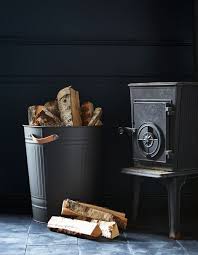 Next To A Fireplace A Knodd Bin With Leather Handles Holds Firewood For Fire Pit Ikea Hack Firewood Storage Firewood Storage Indoor