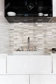 close up of a deep white kitchen sink