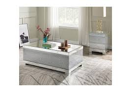 With its clean lines, this brilliant square occasional table showcases a distinctive style for an intriguing look. Noralie Mirrored Coffee Table Rotana Furniture