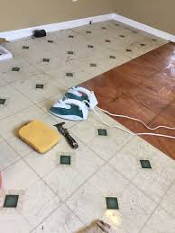 How To Remove Peel And Stick Vinyl Tile The Only Way Three Items Needed 2 Irons 10 Each At Target 1 Stick On Tiles Tile Removal Removing Vinyl Flooring