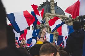 Current flag of france with a history of the flag and information about france country. People Holding France Flag In The Street Photo Free Flag Image On Unsplash