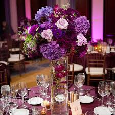 Purple Floral Centerpieces Would Add Blue And Green And White With Less Purple W Purple Wedding Tables Sangria Wedding Purple Wedding Reception Centerpieces