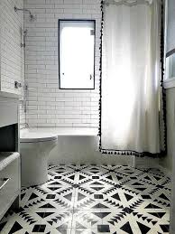 Black And White Shower Curtain Tulum Cement Tiles Create The Look Of An Area Rug In The Center Of The Bathroom In A Geometric Des Black Tile Bathrooms White Bathroom Bathroom Shower Curtains