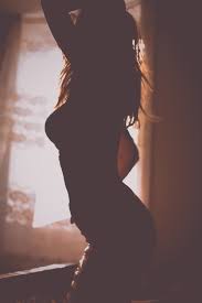 The image of the wooden balls parallels the balls of paper which form in the doctor's pockets en similar to the life trapped inside of the old writer or the passion restrained within wing biddlebaum yet the woman has retreated into such anonymity because of this disease that she finds herself drab. Silhouette Of Woman Bending Her Body Inside Room Photo Free Back Image On Unsplash