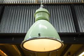 A light fixture (us english), light fitting (uk english), or luminaire is an electrical device that contains an electric lamp that provides illumination. Large Industrial Factory Lights Peppermill Interiors