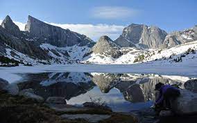 This rugged piece of the rocky mountains, extending for approximately 80 miles along the western slope of the continental divide, contains a unique combination of jagged granite rock, alpine forest, and open alpine meadows. In The Wind River Water Institute For Biospheric Studies
