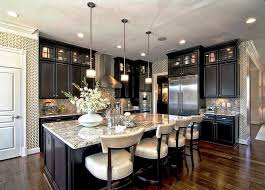 Black granite or marble surfaces add gravitas to rustic wood shelves or a colorful tile backsplash. 9 Stunning Dark Cabinet Kitchen Ideas Art Of The Home