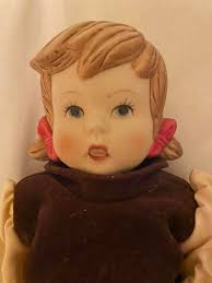 Hi, Can anyone offer any advice about these two dolls please. Doll  measurements: 22cm high They are all porcelain. And are held together  (arms, legs, head by some kind if string inside