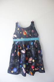 Planets Dress A Fantastic Planetary Print On Black Fabric With A Green Sash That Ties In A Bow At The Back Planet Dresses Space Dress Space Outfit