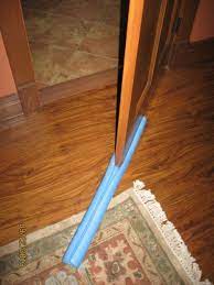 A door sweep consists of a brush made from plastic or vinyl bristles secured in place against the a disadvantage of a door sweep is the drag they have on a carpet making it difficult to open and close. The Easiest Homemade Door Sweep Fine Homebuilding Pool Noodles Door Sweep Pool Noodle Diy