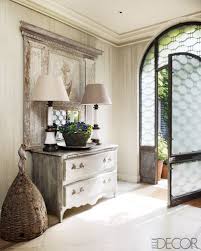 Phenomenal Door The Soft Hued Wood Furnishings In This Entry Foyer Play Down Very Well With That Attention Commanding Door Home Home Decor Interior Design