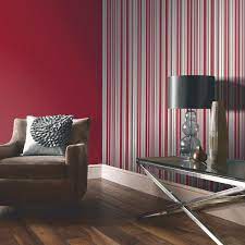Update your living room with these stunning wallpaper designs. Arthouse Sophia Stripe Wallpaper In Red Go Decorating Room Colors Red Living Room Decor Black Walls Living Room