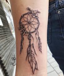 Wherever you see a flower, there is also a butterfly hovering this dream catcher tattoo on thigh adds perfection to the lightness of her skin. 155 Best Dreamcatcher Tattoo Ideas That You Can Consider Wild Tattoo Art