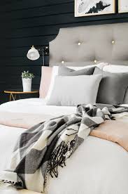 Delicate interior of a bedroom in blue tones with baskets and vases with tulips. Modern Farmhouse Bedroom Makeover For Under 300 Joyful Derivatives