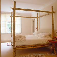 Natural raw sanded bamboo with interesting head board and canopy cross work patterns. Simon Upton The Interior Archive Bamboo Bed Frame Bamboo Bedroom Canopy Bed Frame