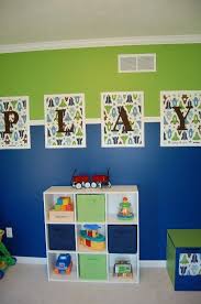 A colorful bright play sign is perfect for the corner of a room designated for coloring, pretending, and dressing up. Playroom Wall Hanging Playroom Paint Colorful Playroom Playroom Color Scheme