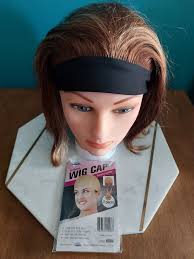 Selling a Wig/Mannequin Combo. Wig with black headband attached. adjustable  plus, deluxe wig cap 2 pieces. one size fits all. thin stocking fabric  polyester material very fashionable. if interested. text or call