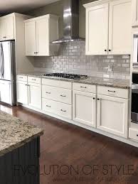 Benjamin Moore S Grand Teton White And Temptation Painted Cabinets Kitchen Cabinets Makeover New Kitchen Cabinets Kitchen Cabinet Design