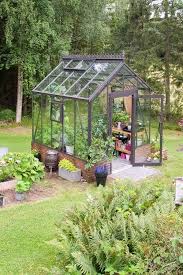 We Re Calling It Tiny Greenhouses Are The Next Big Thing In Backyards Backyard Greenhouse Greenhouse Gardening Small Greenhouse