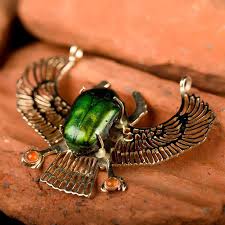 With that knowledge i decided to search the golden scarab, alchemy the top result was synchronicity: Genuine Egyptian Scarab Talisman Gold