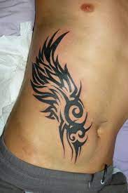 Vertical rib tattoos most populars of vertical rib tattoosthe best of vertical rib tattoostop 10 of vertical rib tattoosmost populars of vertical rib. Male Rib Cage Tattoo Designs Tribal Tattoos For Men Cool Tribal Tattoos Tribal Tattoos