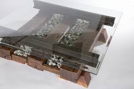 Rather, it includes a sophisticated multilevel layout, capable of running two trains and a trolley simultaneously through a southwestern landscape that is full of surprises. Timber Stone And Upcycled Steel Coffee Table
