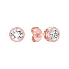 A side by side comparison. White Sapphire And 14k Rose Gold Earrings Shane Co