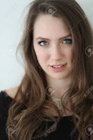 Sponged with alcohol painted the stud with clear nail pol развернуть. Photo Of A Very Attractive Woman With Brown Hair And Blue Eyes Shot Against A White Wall Stock Photo Picture And Royalty Free Image Image 71886786