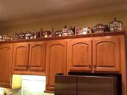 Christmas Village On Top Of The Cabinets Christmas Apartment Christmas Village Sets Christmas Village Display