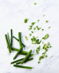 Connecting into the leaves, the white base is dense, succulent, and firm with small white roots. How To Cut Green Onions A Couple Cooks