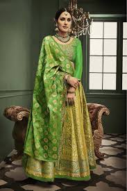 For an ethnic look, a blue color lehenga choli can be designed in new styles. Banarasi Silk Lehenga Choli In Lemon Green Colour