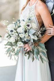 This bouquet of iris, hydrangea and delphinium offers a much deeper blue for brides. Natural Shades Of Blue And Gold Boho Wedding Inspiration Pretty Wedding Bouquet Boho Wedding Inspiration Wedding Flower Guide