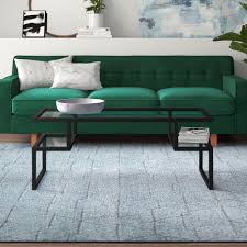 Its tempered glass top sits atop four sleek rounded legs, which in turn sit atop white manufactured wood legs, with a tempered glass lower shelf perfect for hosting extra magazines or. Black Glass Coffee Tables You Ll Love In 2021 Wayfair