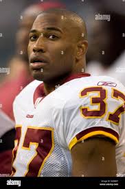Washington Redskins running back Shaun Alexander watches from the sidelines  in the fourth quarter against the Seattle Seahawks at Qwest Field in  Seattle