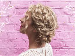 This bun is created by cutting the toe end of a tube sock off, rolling it up, threading a pony tail through and pinning the strands back down, over the sock. Party Hairstyles For Natural Curly Hair Easy Updos Verily