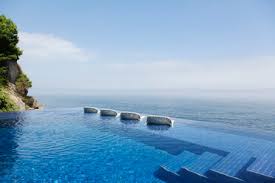 We have gathered some pool areas that charmed by pool lounge chairs. Couple In Lounge Chairs In Infinity Pool Overlooking Ocean Caif17935 Martin Barraud Westend61